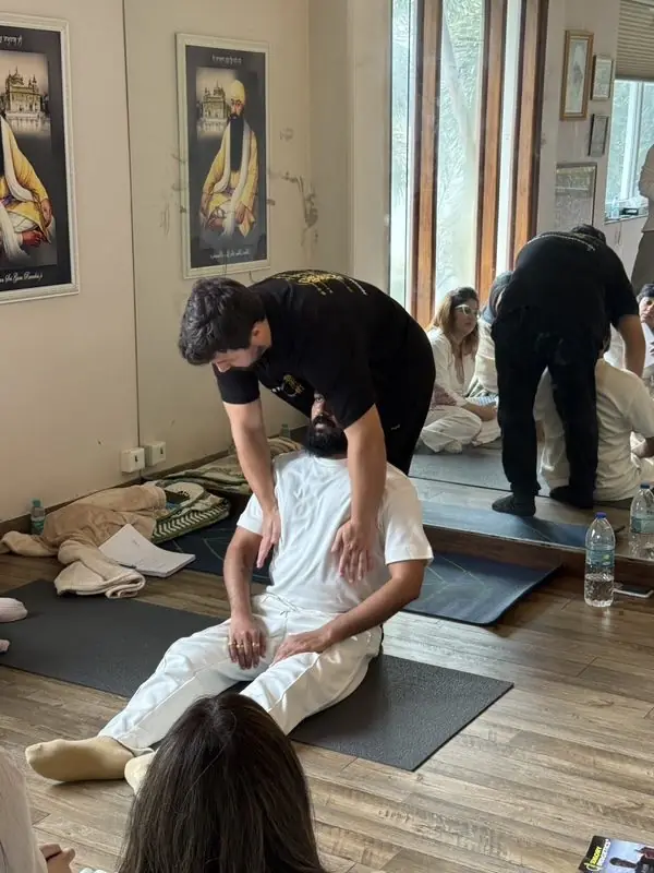 Dr. Daniel Flash working on the back of a seated client