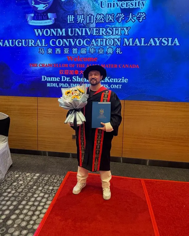 Dr. Daniel Flash on stage at the WONM University inaugural convocation in Malaysia