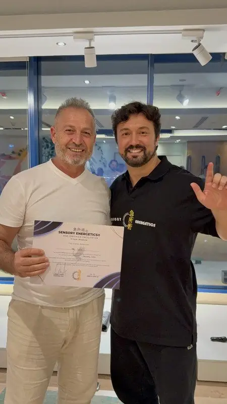 Dr. Daniel Flash with a newly certified facilitator holding his certificate
