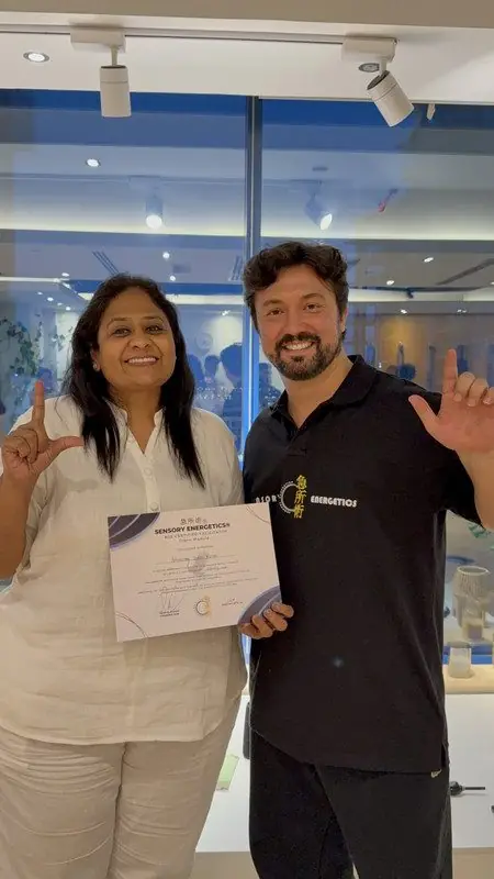 Dr. Daniel Flash with a newly certified Sensory Energetics facilitator holding her certificate