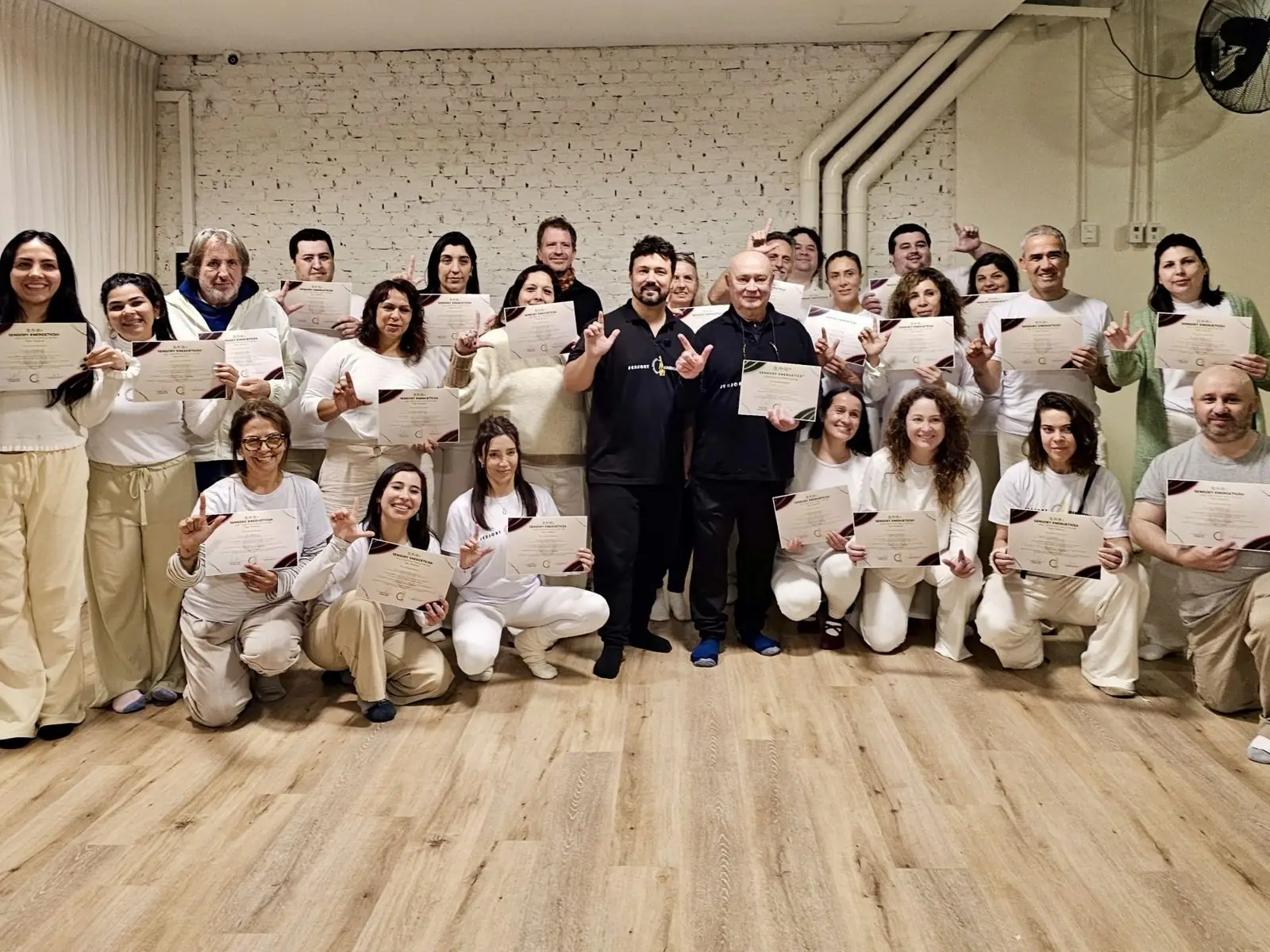 Sensory Energetics graduates with Dr. Daniel Flash and Master Kong holding their certificates