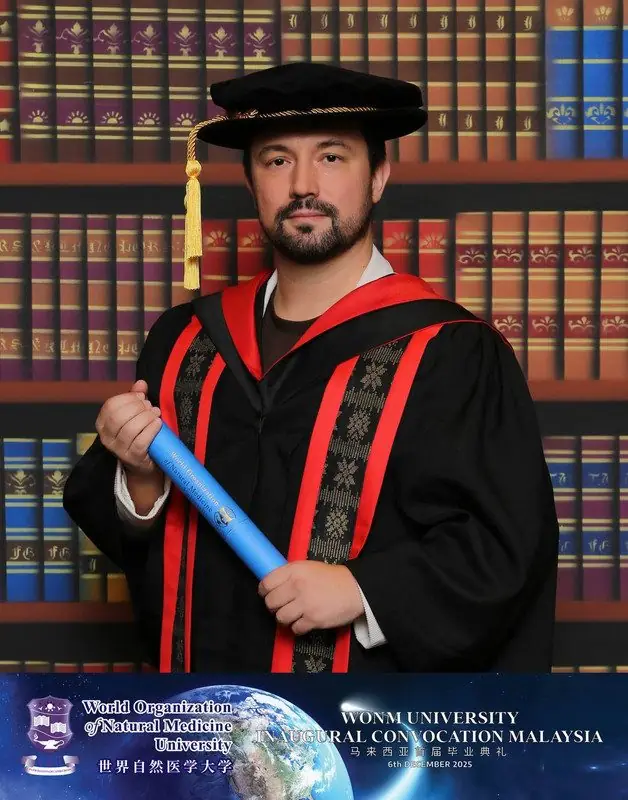 Dr. Daniel Flash in doctoral gown at the WONM University convocation in Malaysia