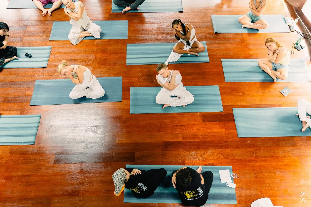 Overhead view of students lying on mats during a Sensory Energetics session
