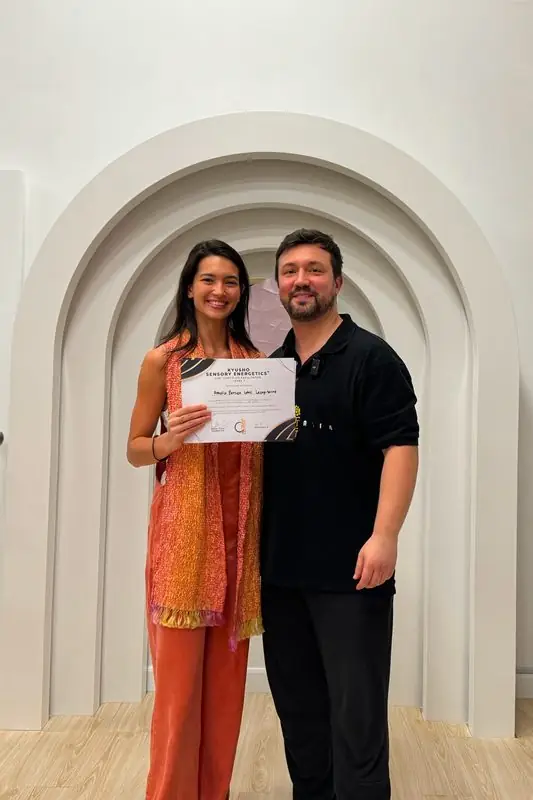 Dr. Daniel Flash with a new facilitator holding her certificate