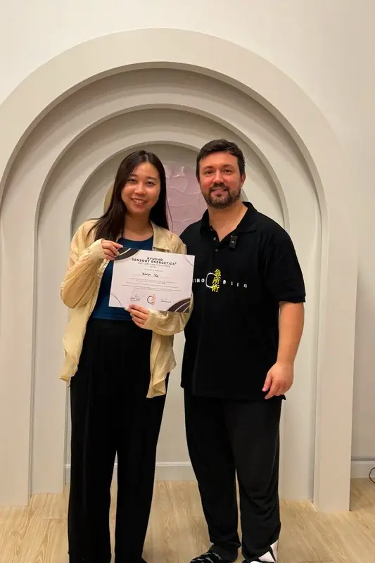 Dr. Daniel Flash with a new facilitator holding her certificate