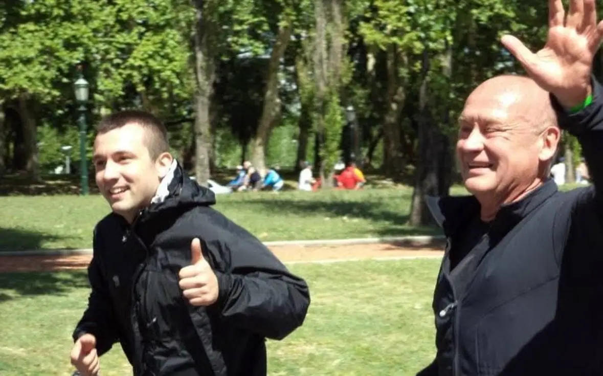 Dr. Daniel Flash laughing with his father Master Kong in a park