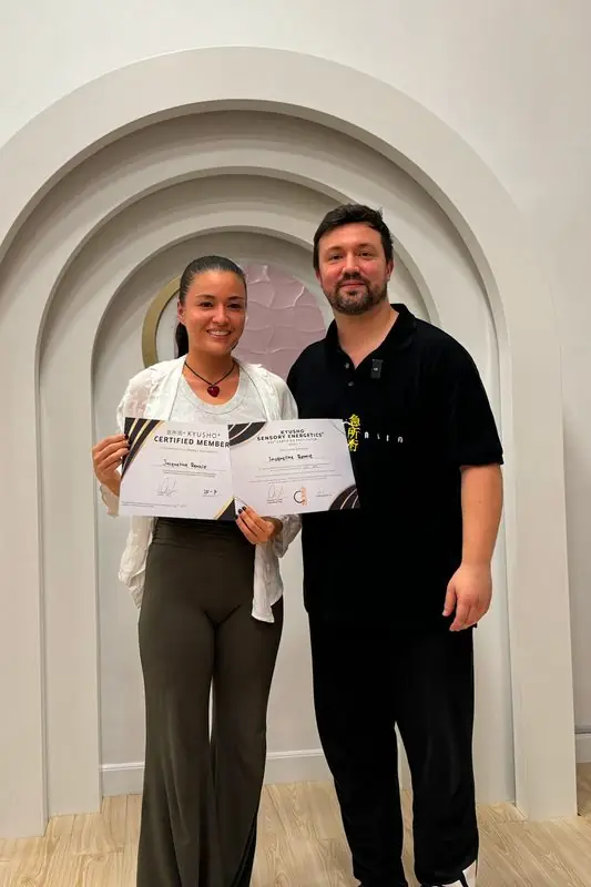 Dr. Daniel Flash with a new facilitator holding her certificate
