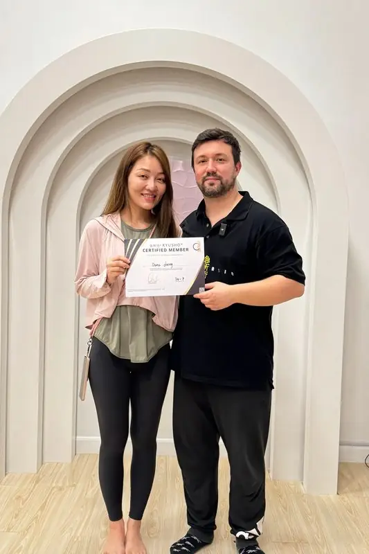 Dr. Daniel Flash with a new facilitator and her certificate